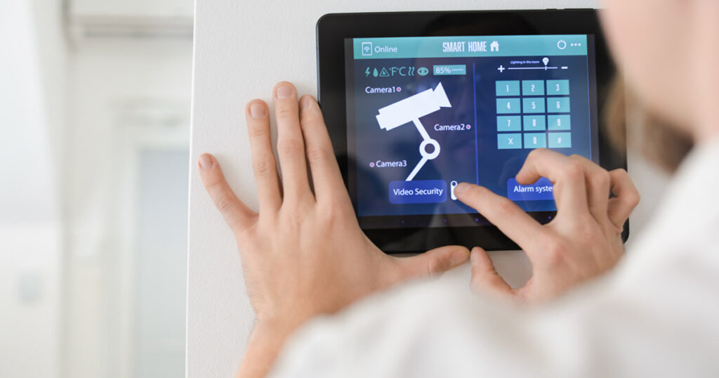 A homeowner setting up an alarm system