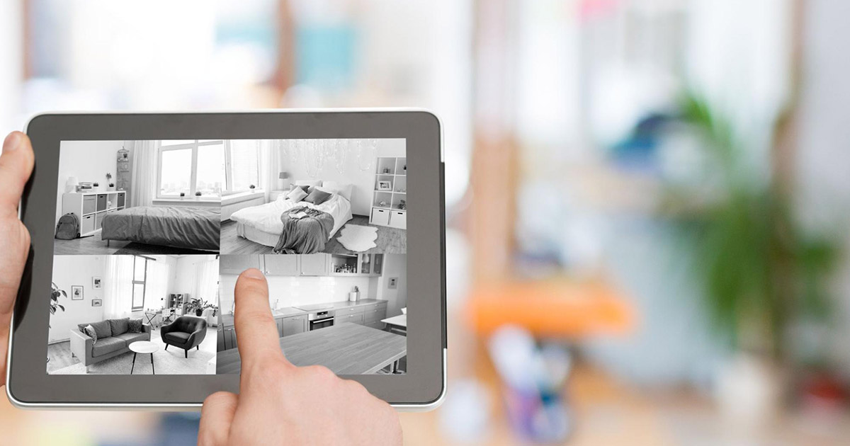 A tenant monitors his home with a tablet