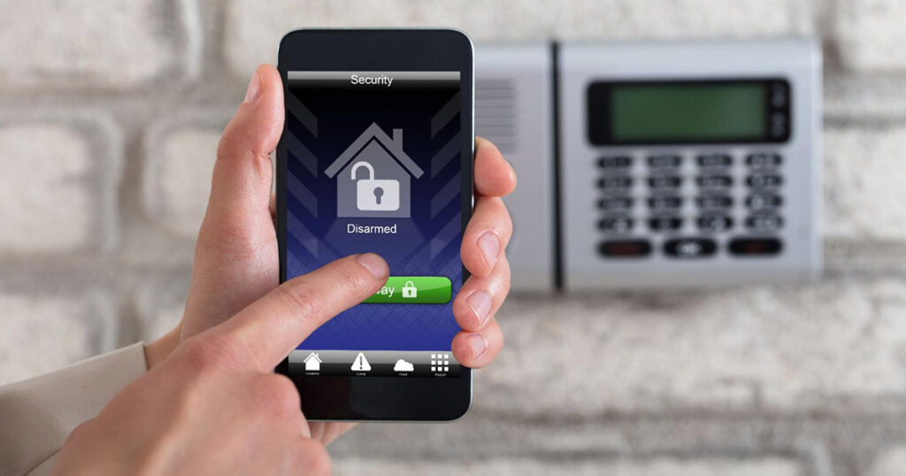 A homeowner disarms his security system using his phone